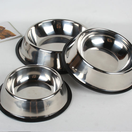 Stainless steel bowls on a white surface