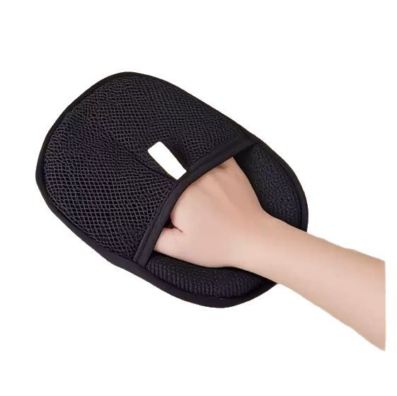 Black mesh glove being worn on a hand against a white background